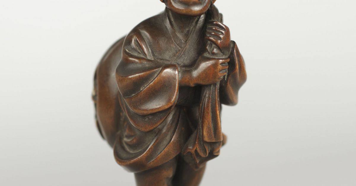 Man Carrying Sack with Oni in It, Netsuke